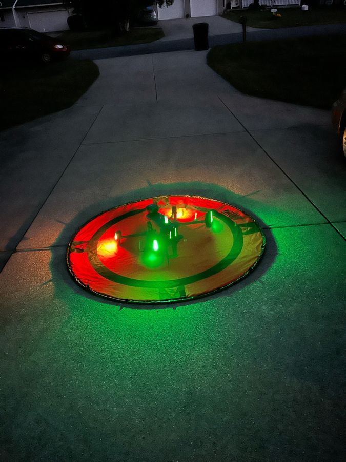 Trophy Tracker drone on illuminated launch pad at night